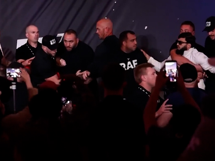 UFC fighter Arman Tsarukyan lunges at Dillon Danis during press conference