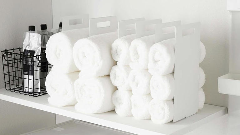 Goodbye messy shelves: Easily store towels with this helpful organizer