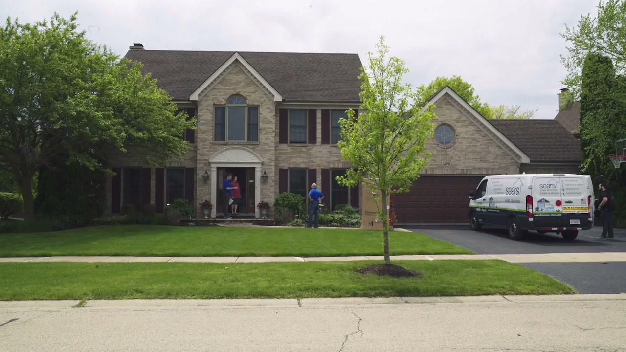 Military husband surprises wife by bursting from Sears delivery box ...