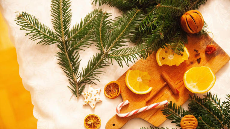 A basic wooden cutting board becomes charming Christmas decor with this ...