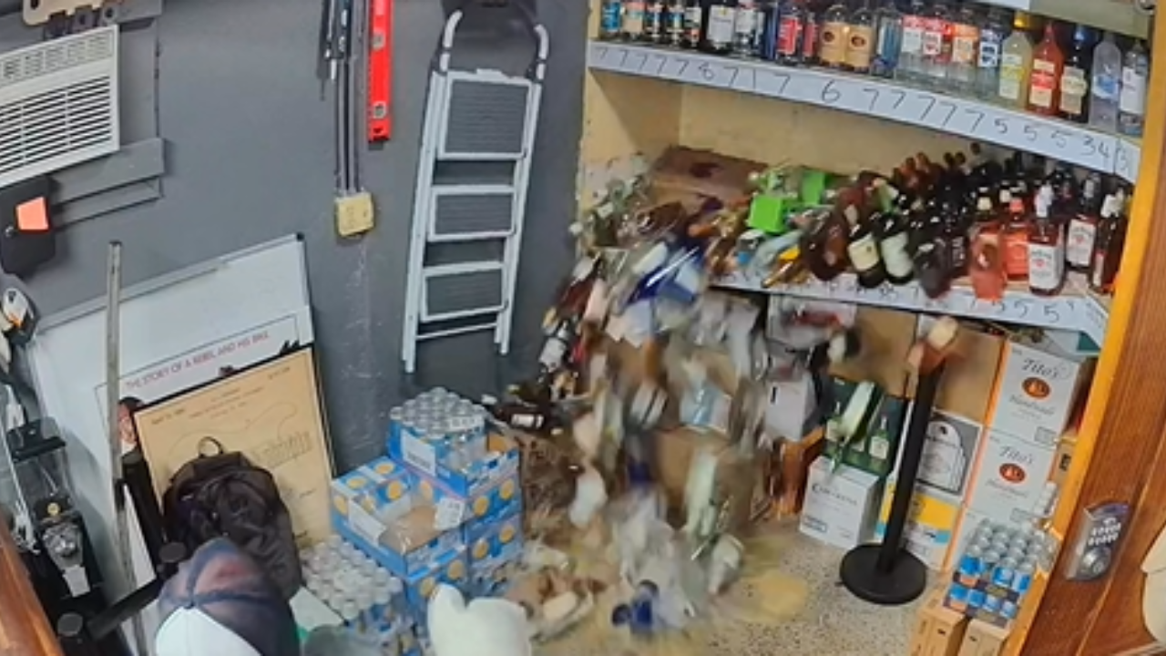 Restocked bar shelf collapse under weight of bottles