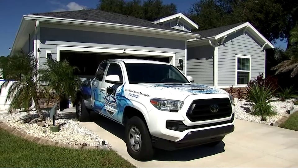 Ormond Beach family fights HOA over rights to park wrapped work trucks