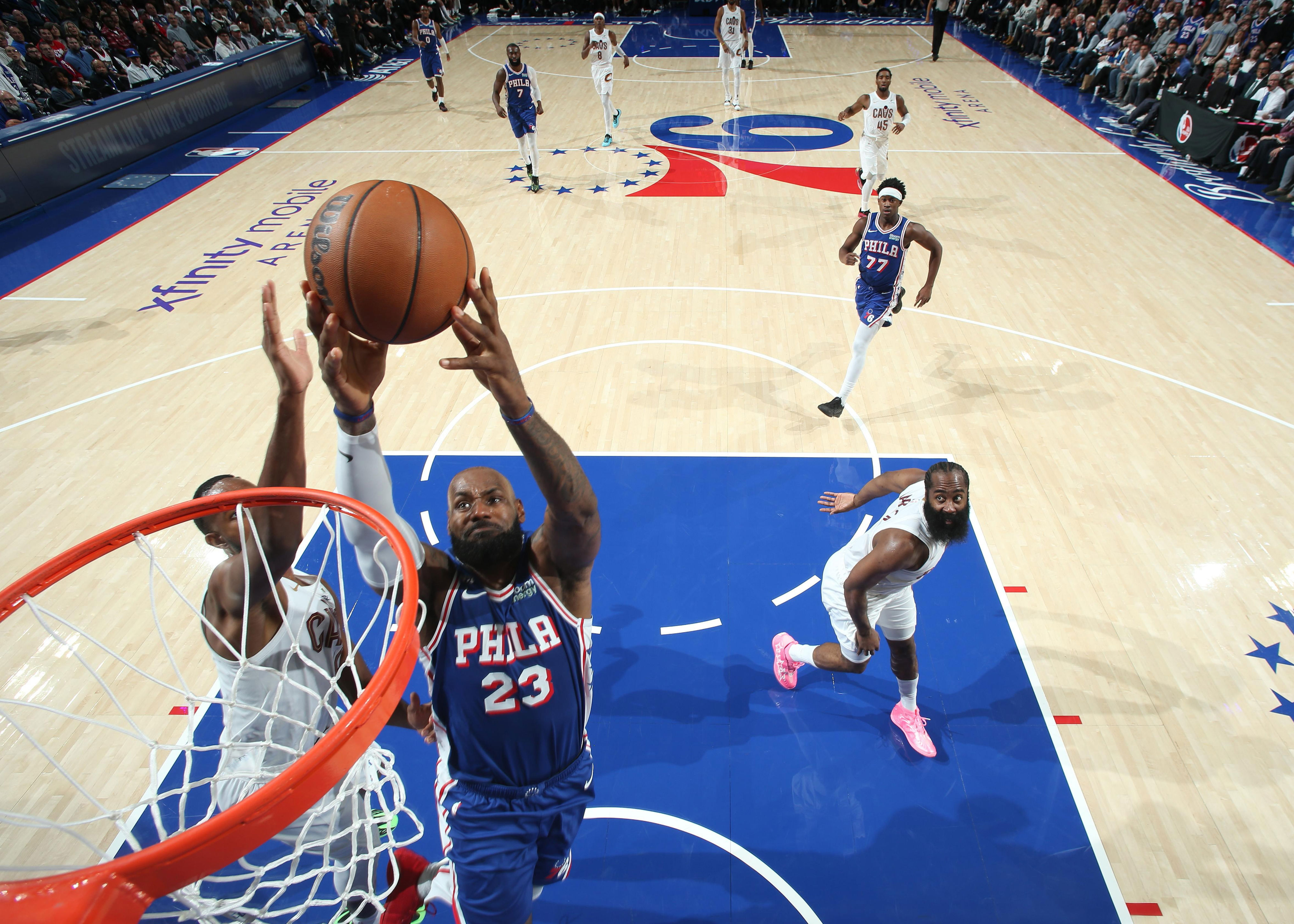 Sixers storm back after lifeless first half to win in LeBron's home debut