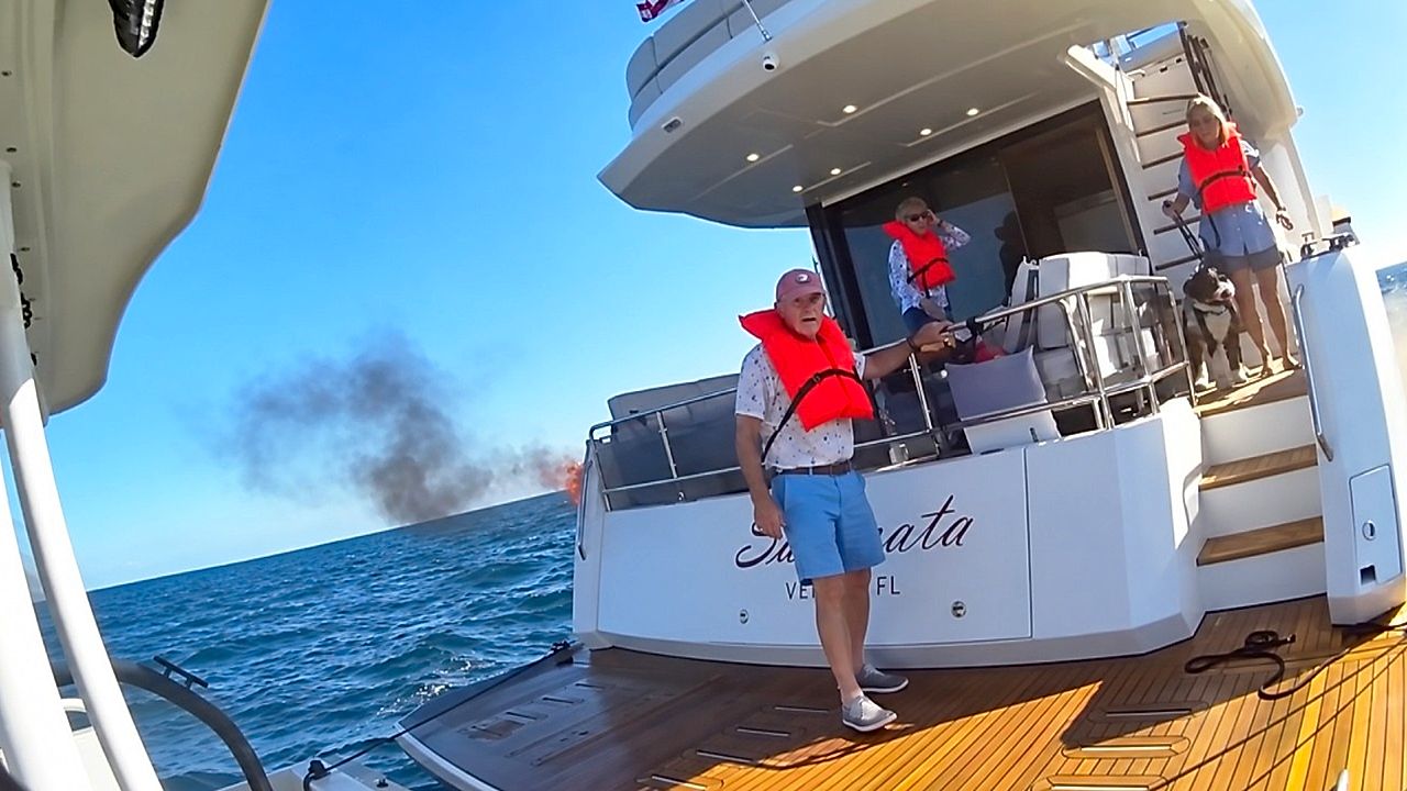 Florida deputies rescue three people and dog from burning boat off Boca ...