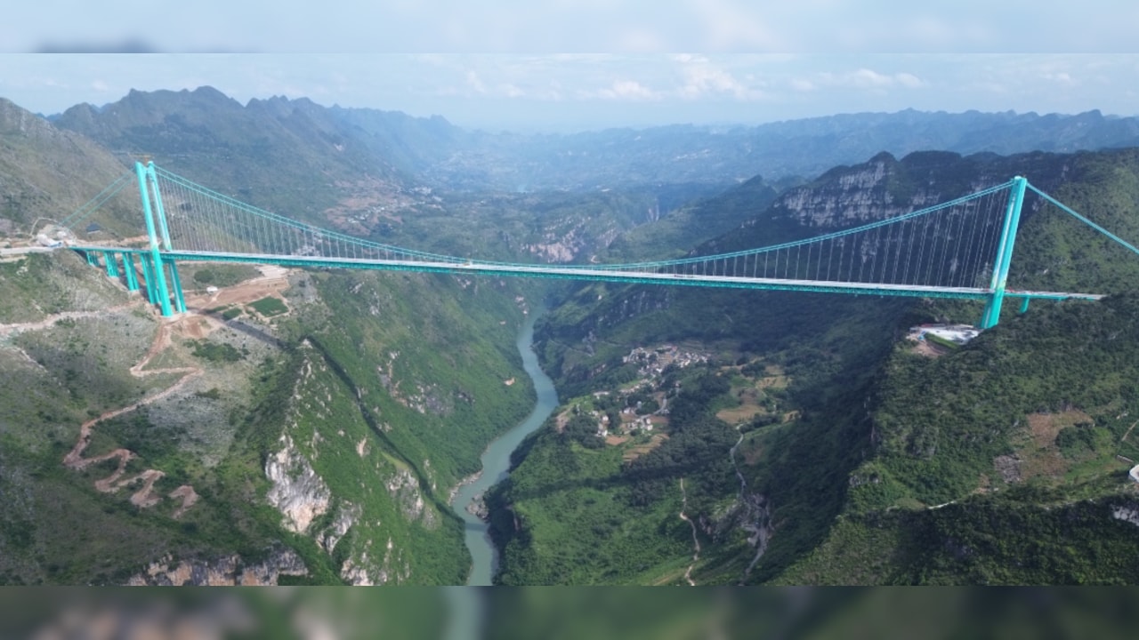 Watch: China turns world's highest bridge into a spectacular river in ...