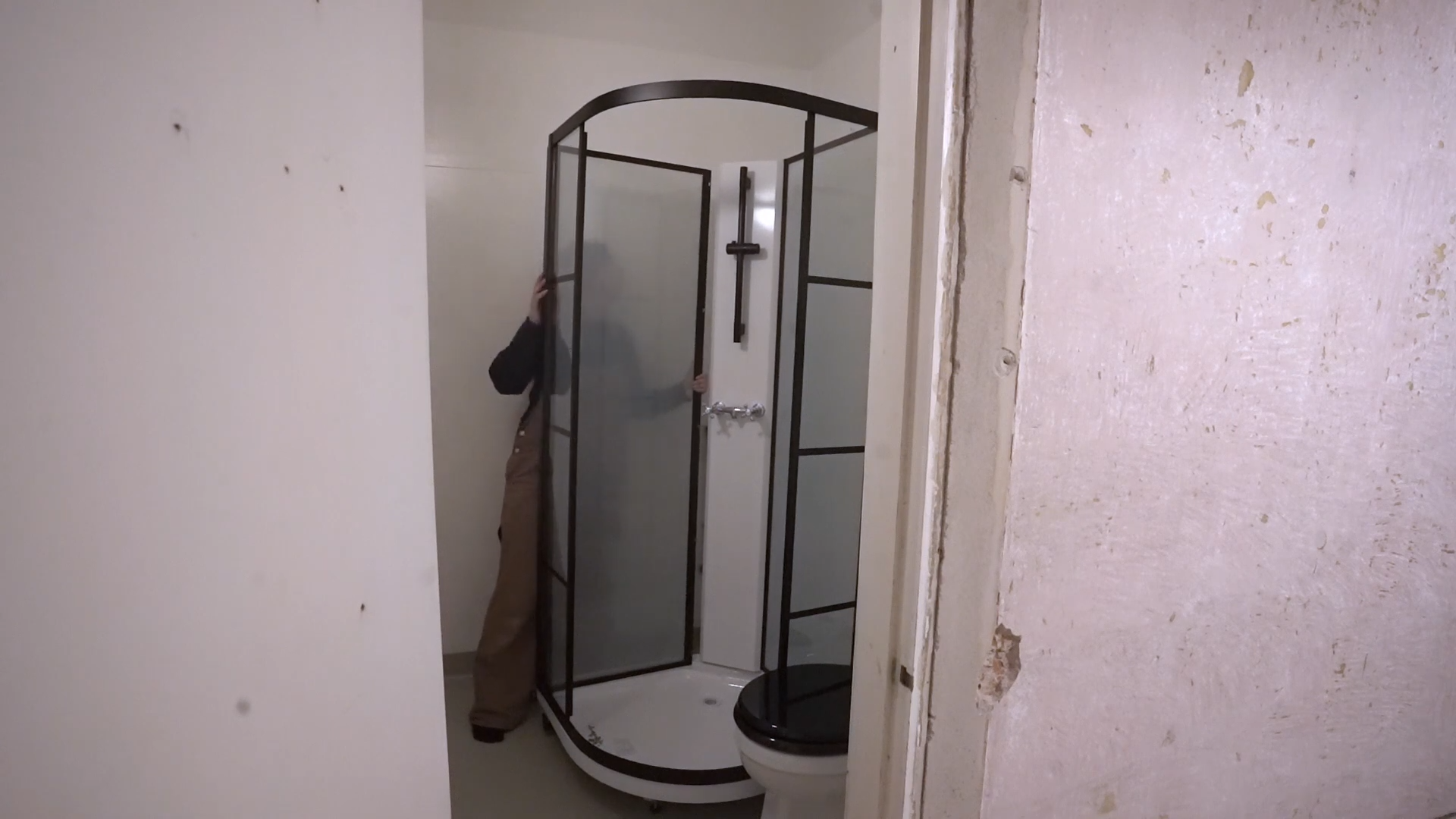 Installing a freestanding shower with classic chrome fixtures and ...