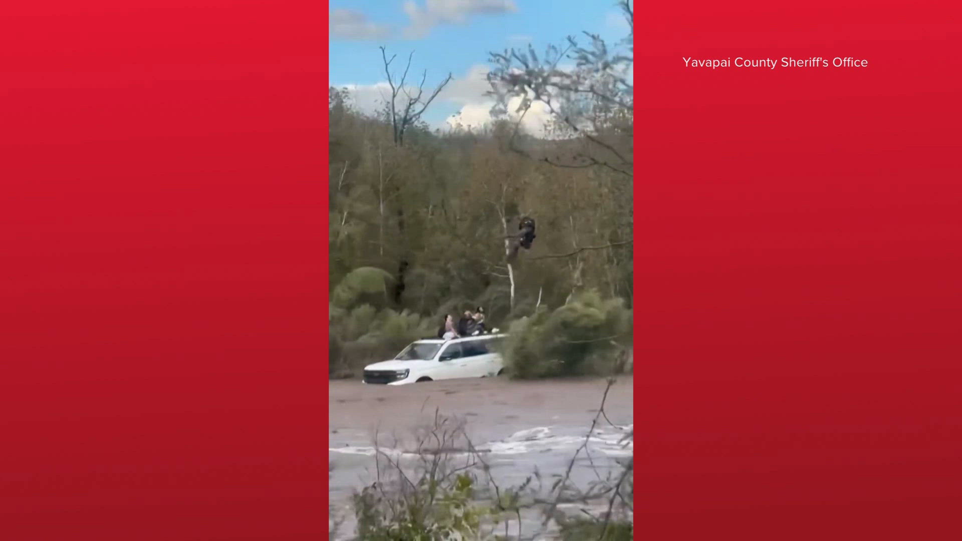Helicopter crew rescues 4 from floodwaters