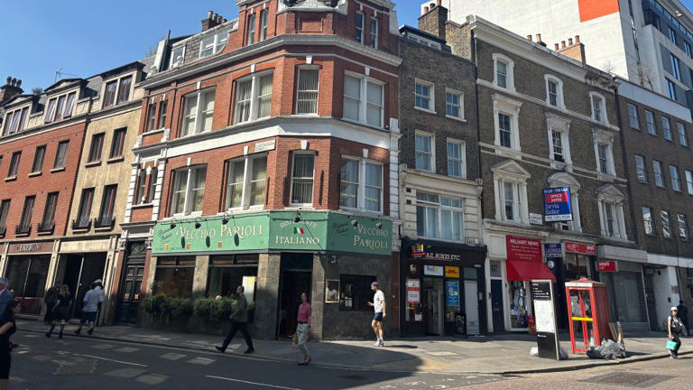 The exterior of Slough House is on the corner of Aldersgate Street and Carthusian Street. Some of the businesses get a makeunder on the show, but fans will recognize Vecchio Parioli Italian restaurant. - Francesca Street/CNN