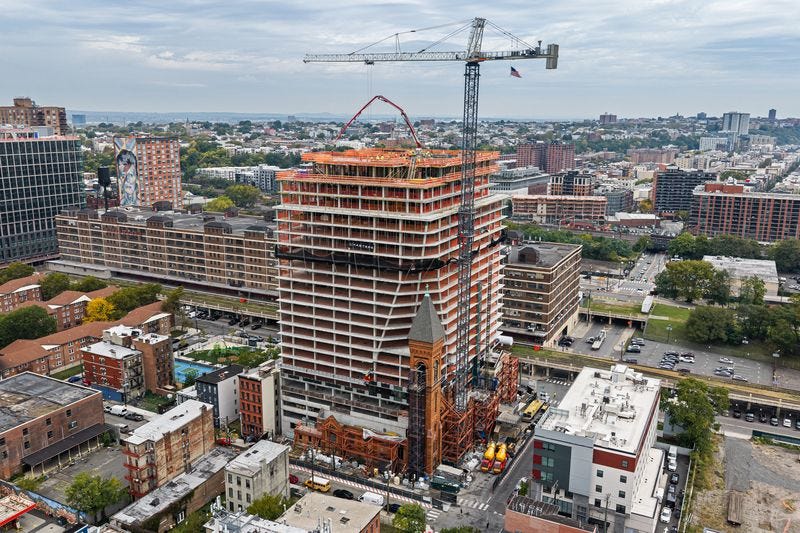 New apartment tower tops out on historic Jersey City church property