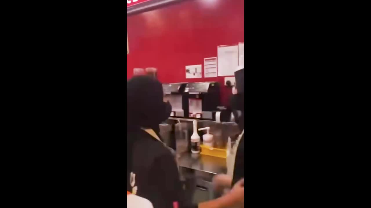 Furious waiter throws bin at aggressive customer in Mixue store