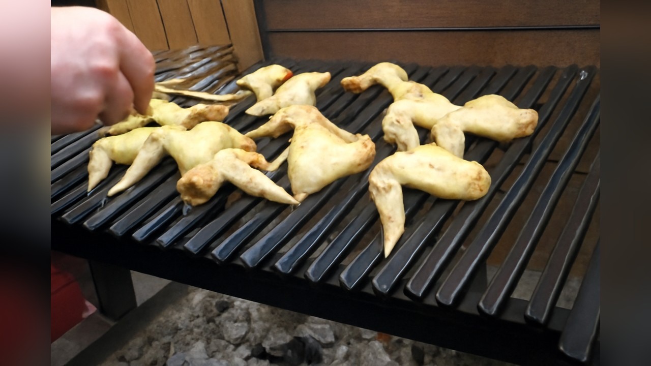 Left wing chicken wings cooked on a Santa Maria grill