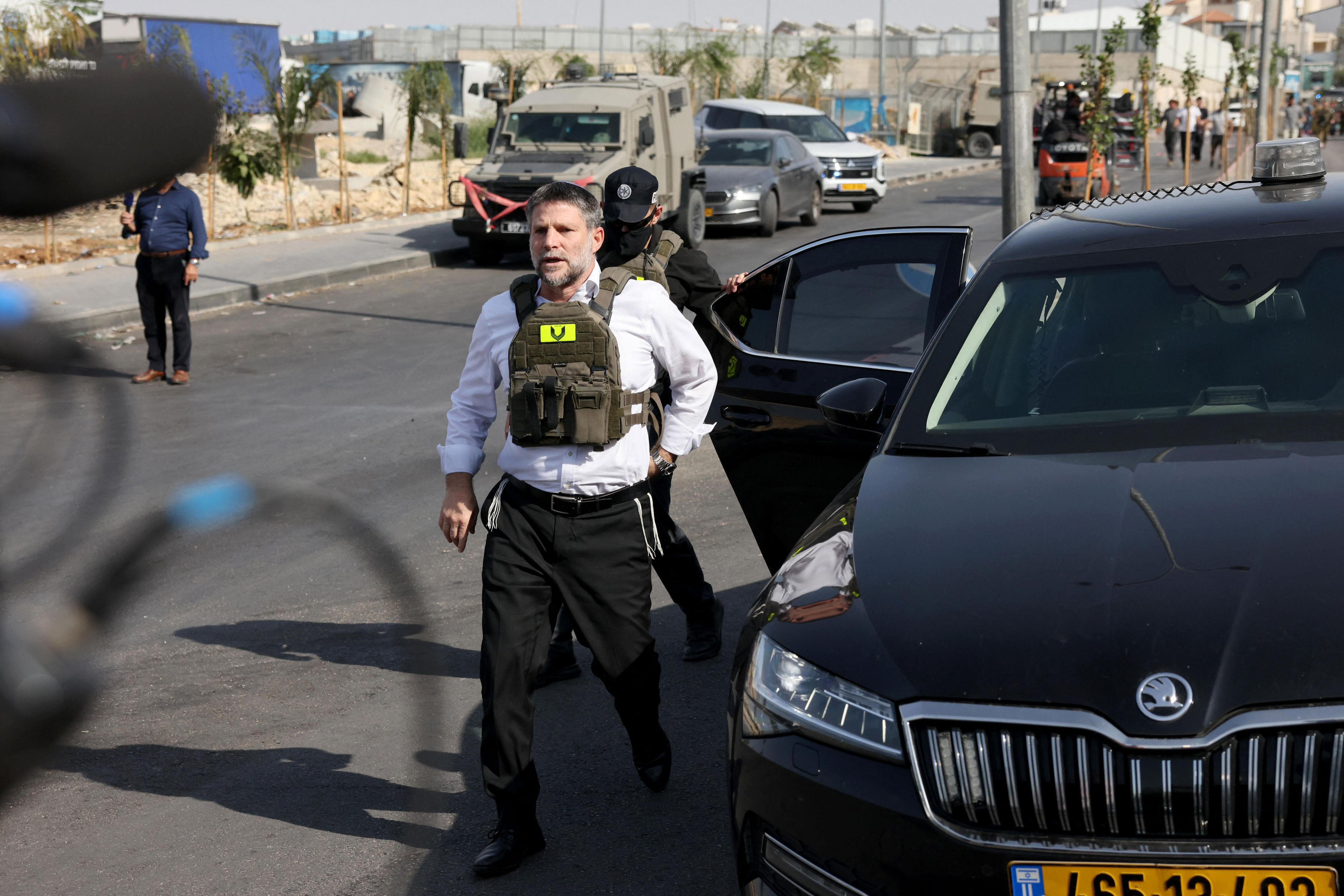 Far-right Israeli Finance Minister Bezalel Smotrich visits the scene of the shooting at a checkpoint near Hebron, in the Israeli-occupied West Bank, Oct. 23, 2026. / Credit: AHMAD GHARABLI/AFP/Getty