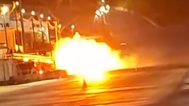 Drag racing car erupts into flames