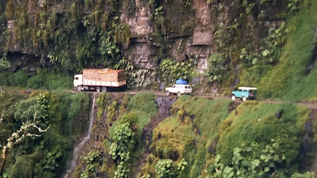 A 10-foot-wide road in Bolivia carried buses and trucks beside cliffs ...