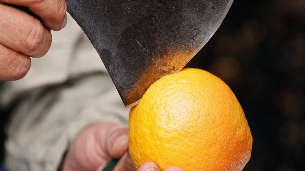 A carpenter fits the axe handle before sharpening, keeping the final ...