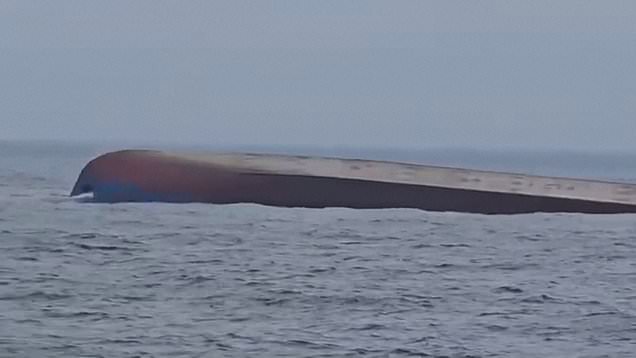 Search for missing crew continues after drone strike capsizes cargo ship