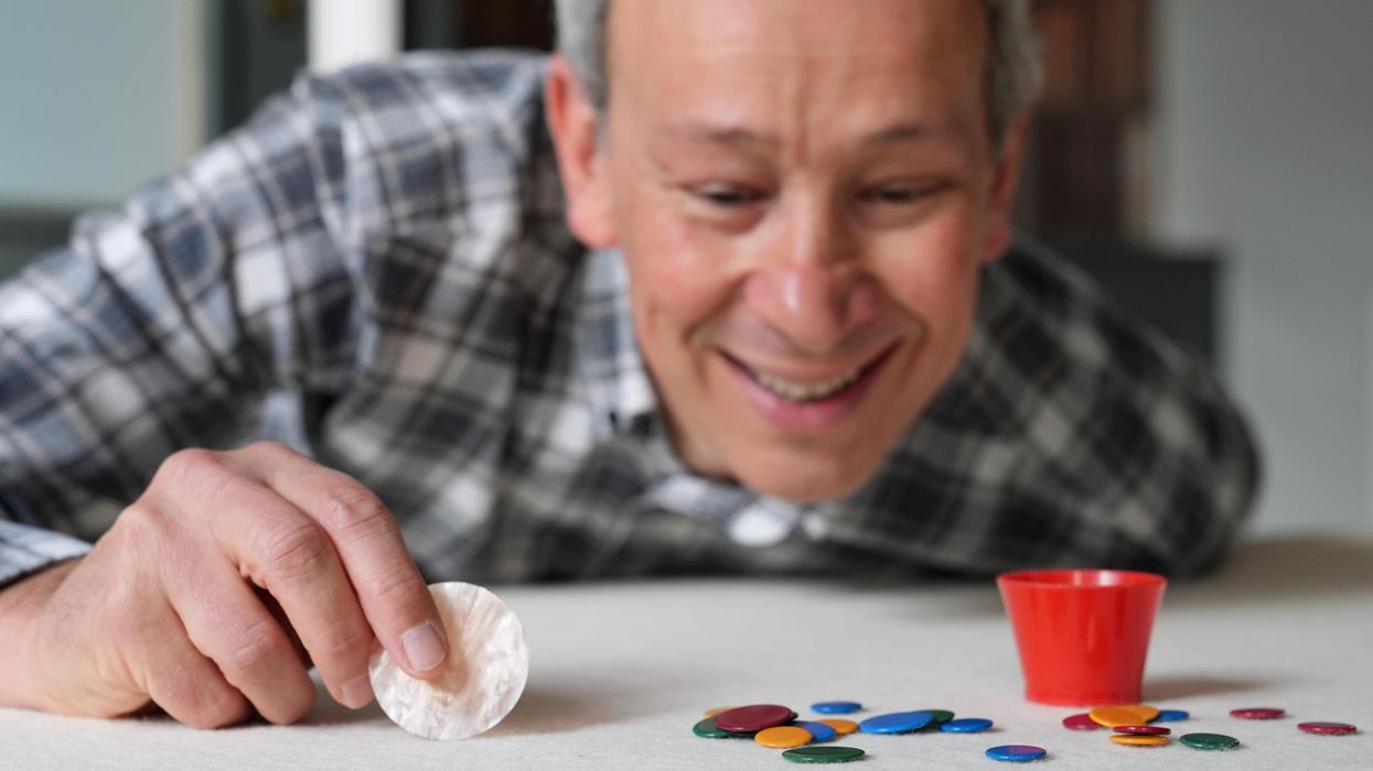 Can he flick it? Yes he can – professor sees off tiddlywinks title ...