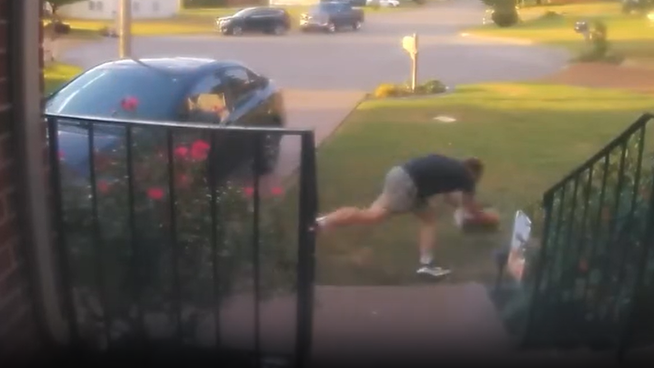 Guy carrying box of piano books takes spill
