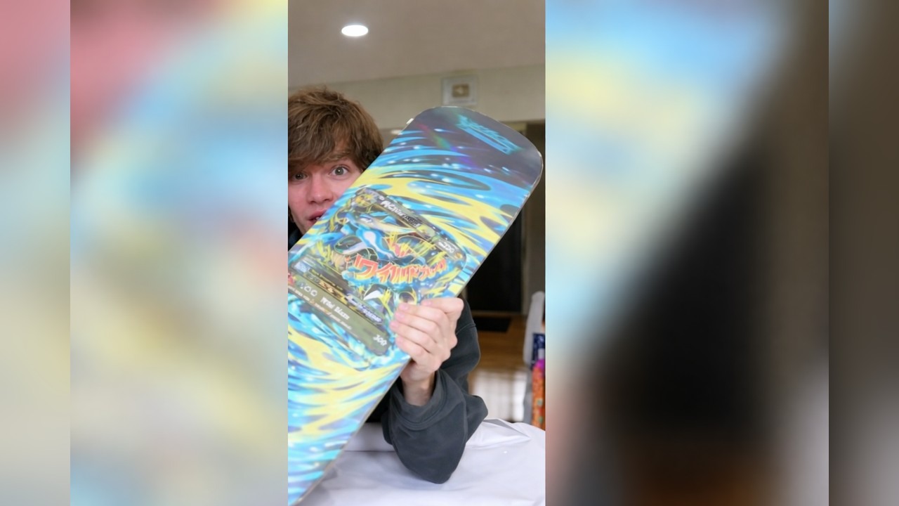 Connor pulls a Mega Charizard EX Santa Cruz Pokémon skateboard deck