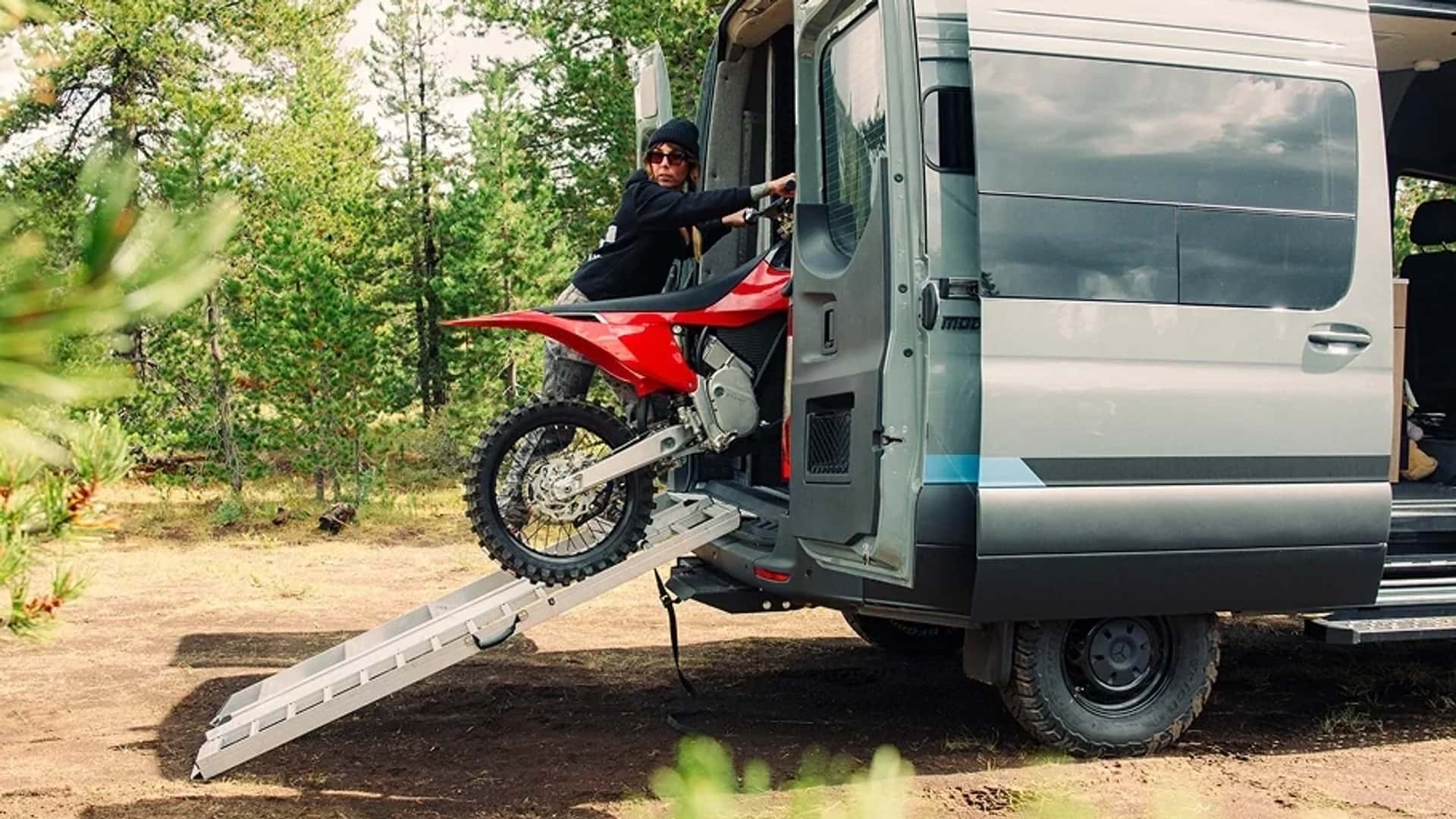 An off-road RV with space for your dirt bikes and a bed. Sign us up