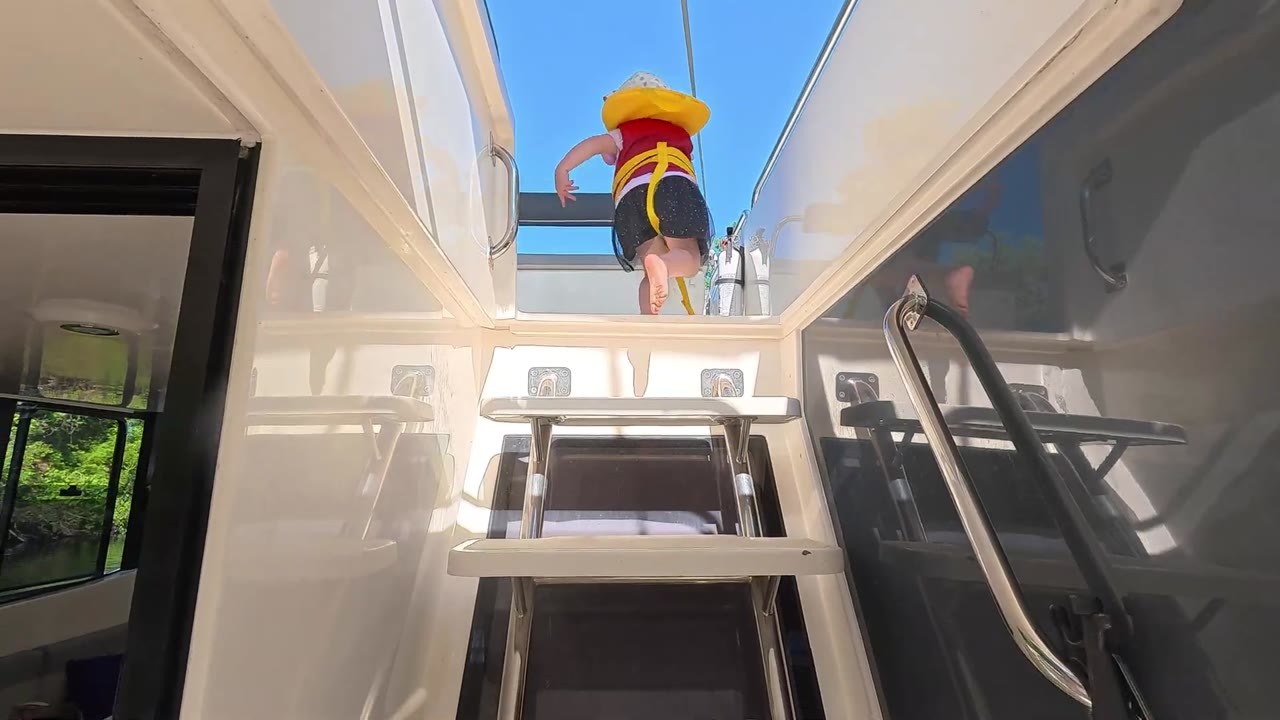 A houseboat crew navigates to Peterborough Lift Lock