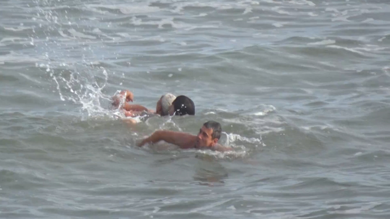 Lifeguards save swimmer in dramatic rescue at Villa Gesell Beach, Argentina
