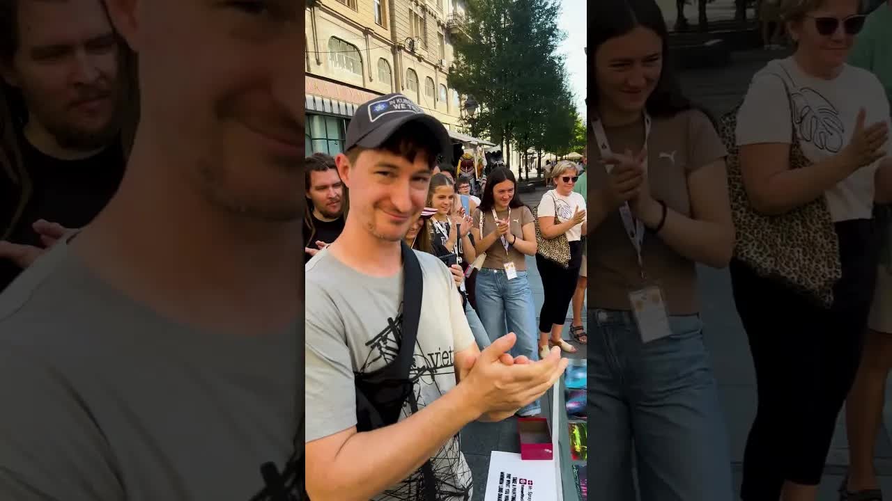 A painter spray paints a stranger's laptop