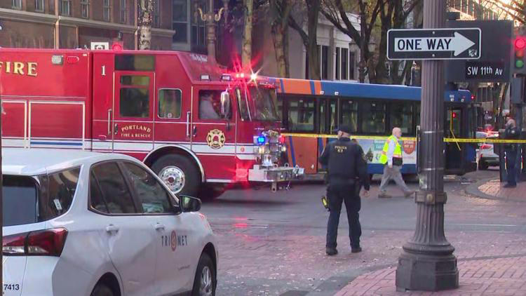 Pedestrian hospitalized after being pinned under TriMet bus
