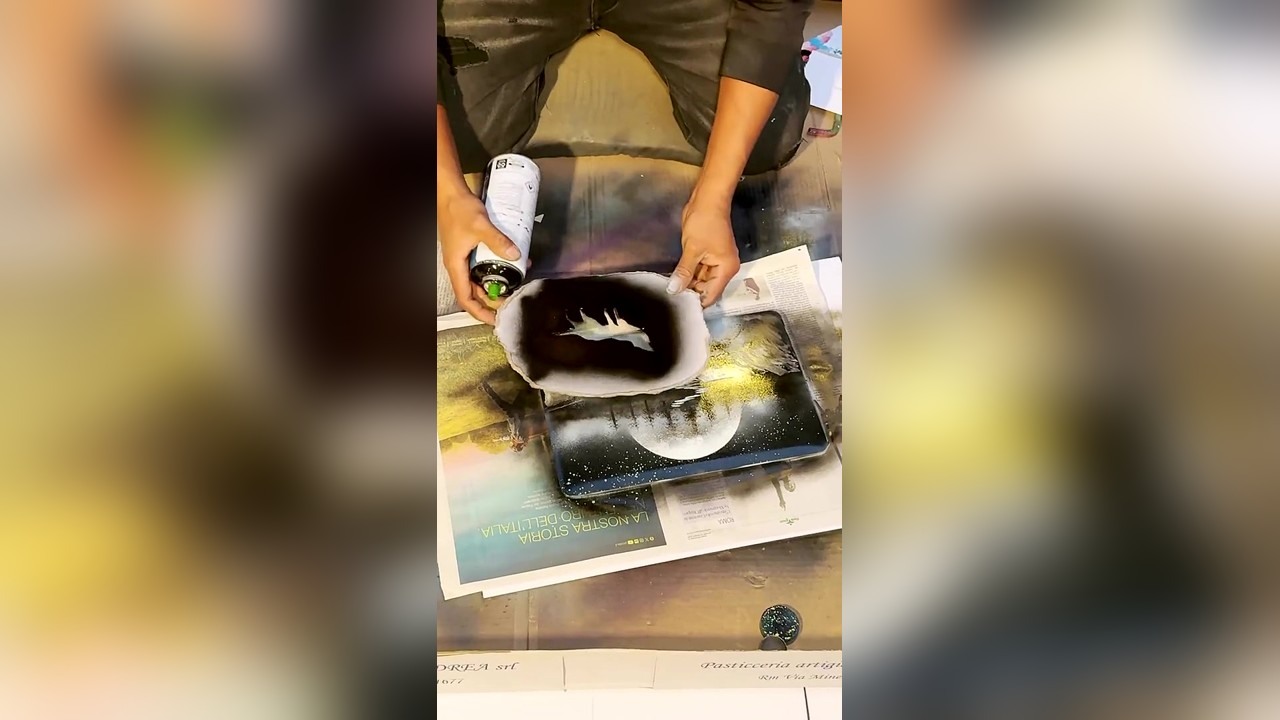 Spray painting €20 artwork for a man