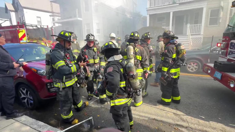 Smoke seen for miles as crews battle massive fire at Malden triple-decker