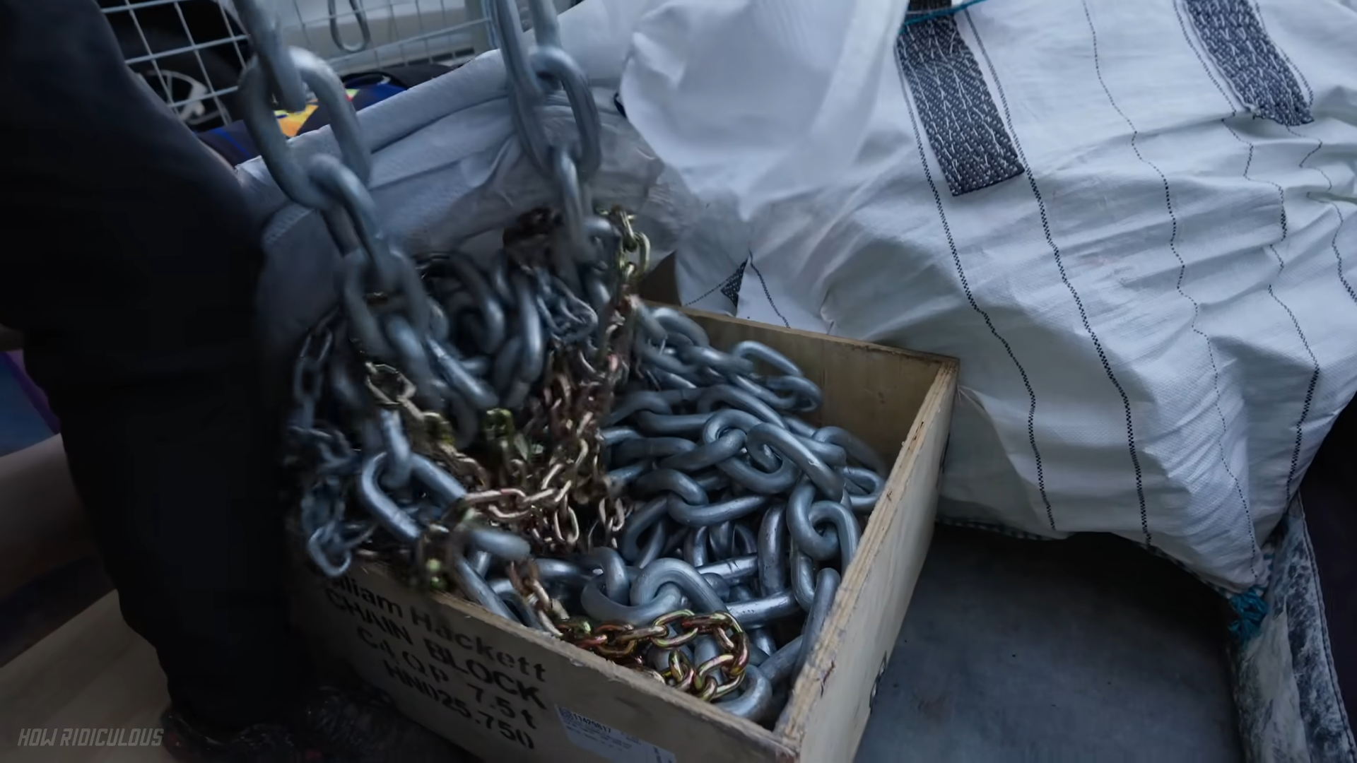 Testing a giant chain whip to see if it can destroy a house