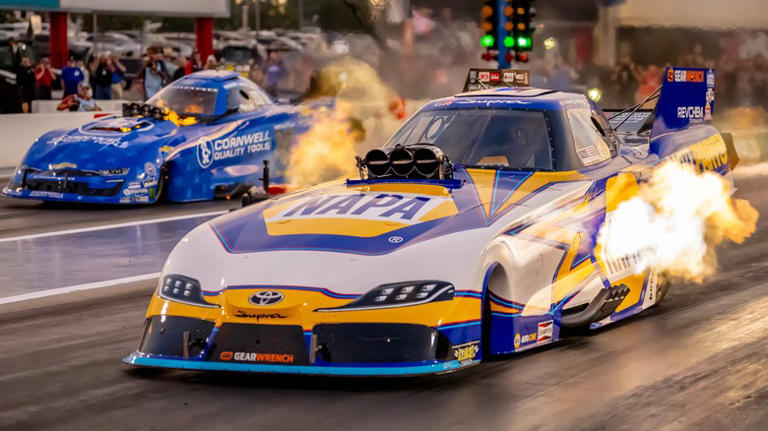 What do they lay down on drag tracks to make the surface so sticky?