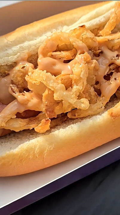 Trying a foot-long hot dog