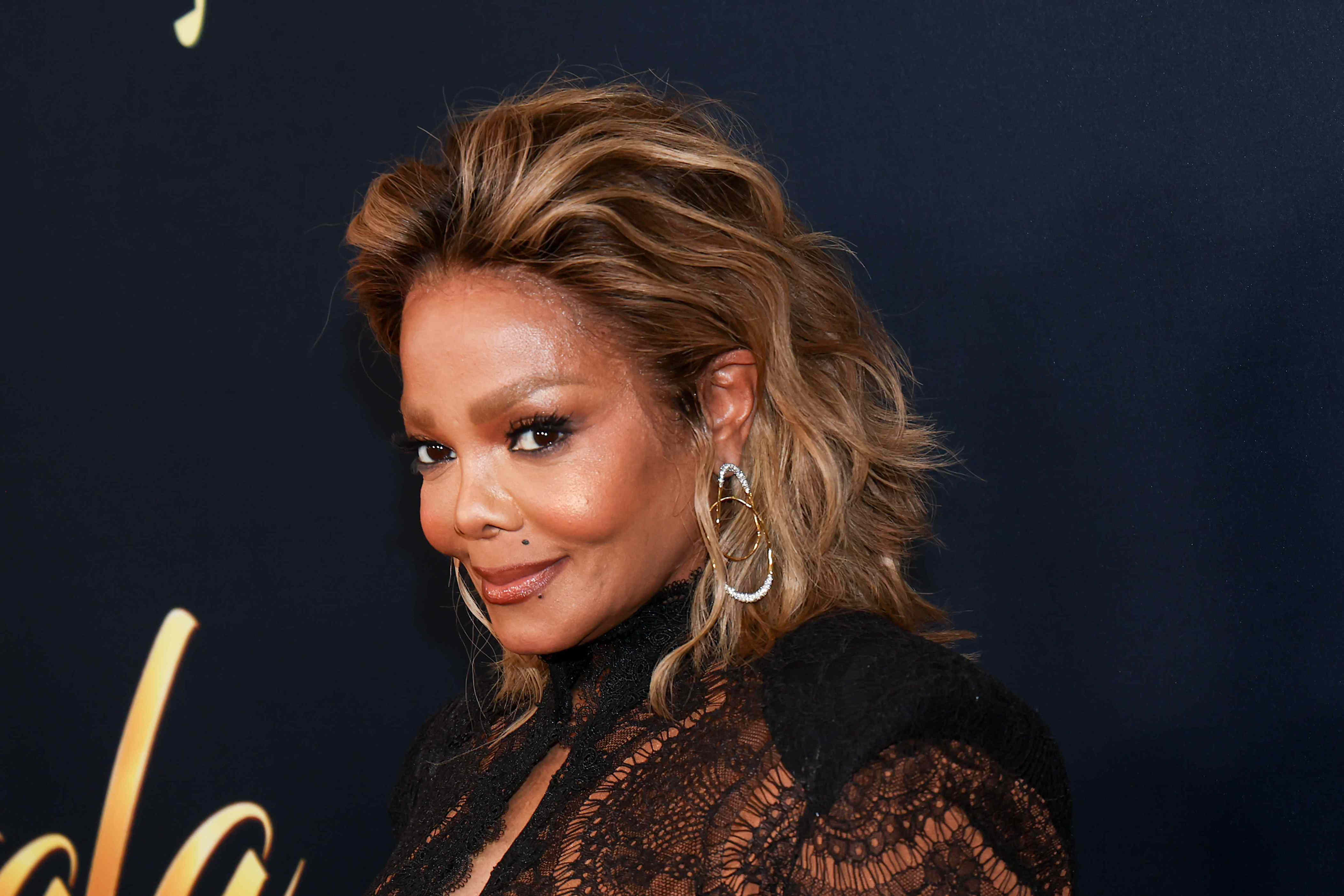 Janet Jackson, 60, wears figure-hugging, plunging lace LBD for rare red ...