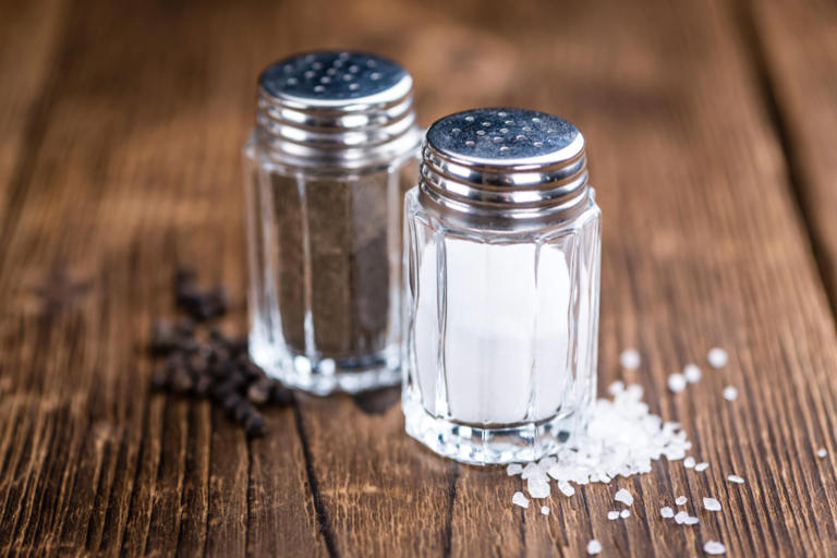 Salt and pepper shakers have different numbers of holes and almost ...