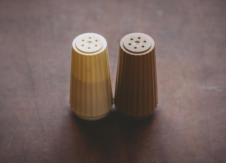 Salt and pepper shakers have different numbers of holes and almost ...