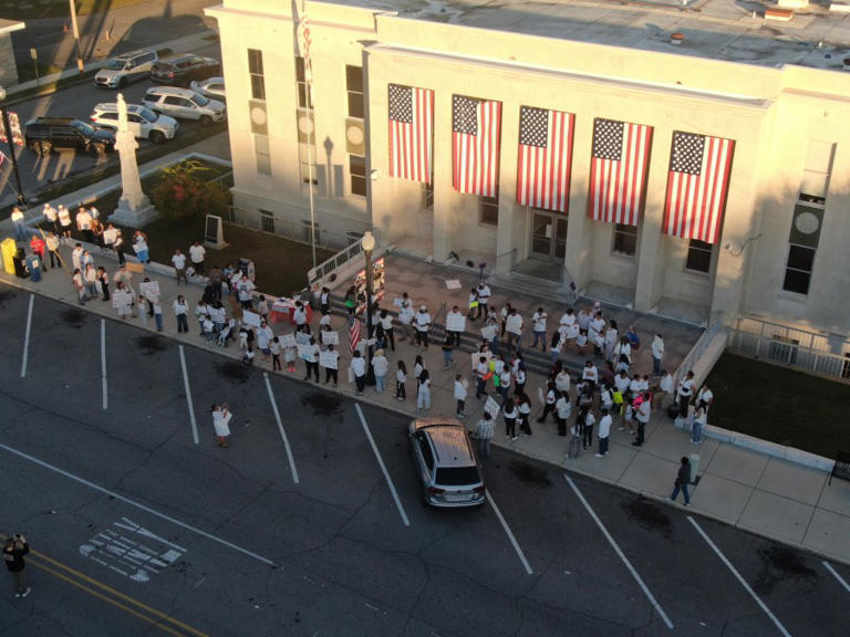 Protesters gather in Russellville opposing ICE crackdown in community