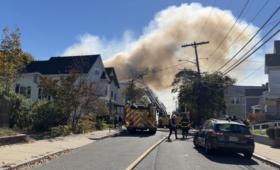 Crews battling massive fire at triple-decker home in Malden