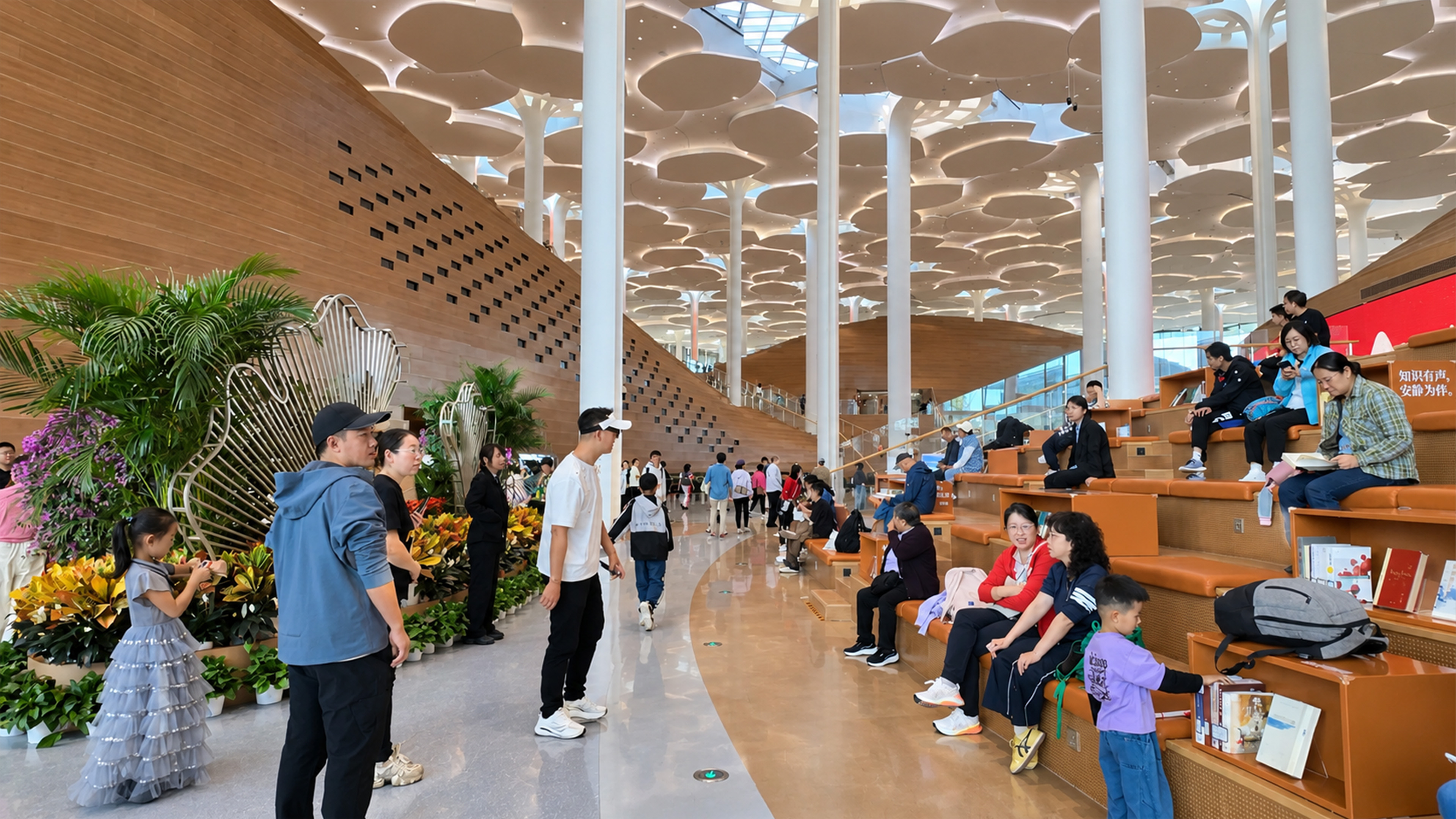 People read and relax on massive wooden steps inside China's library