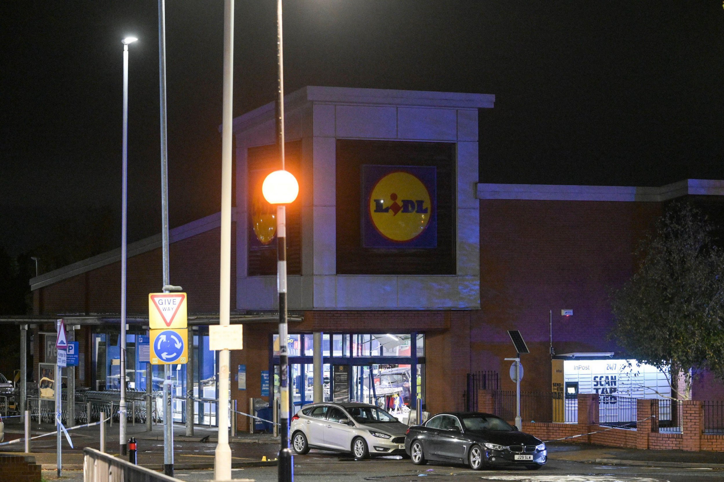 Man dies after car crashes into front of busy Lidl