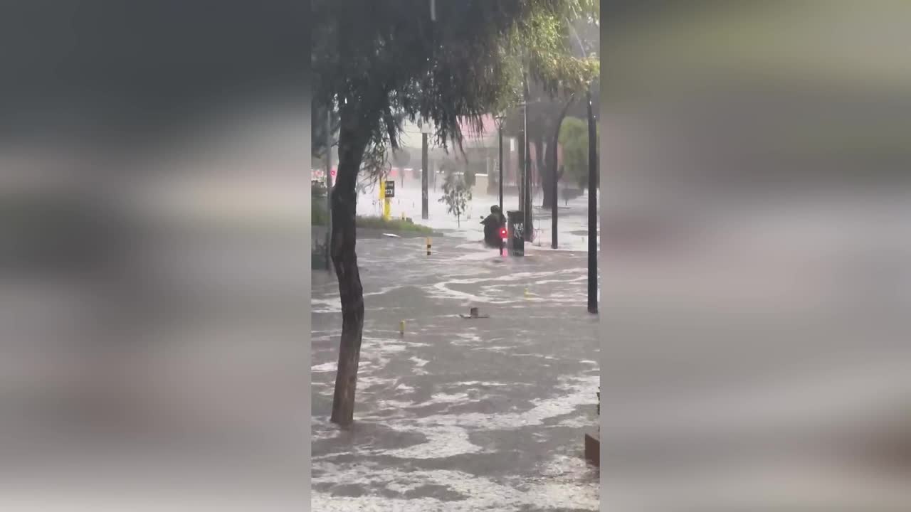 Hail-choked floodwater pours down Quito stairways like waterfalls