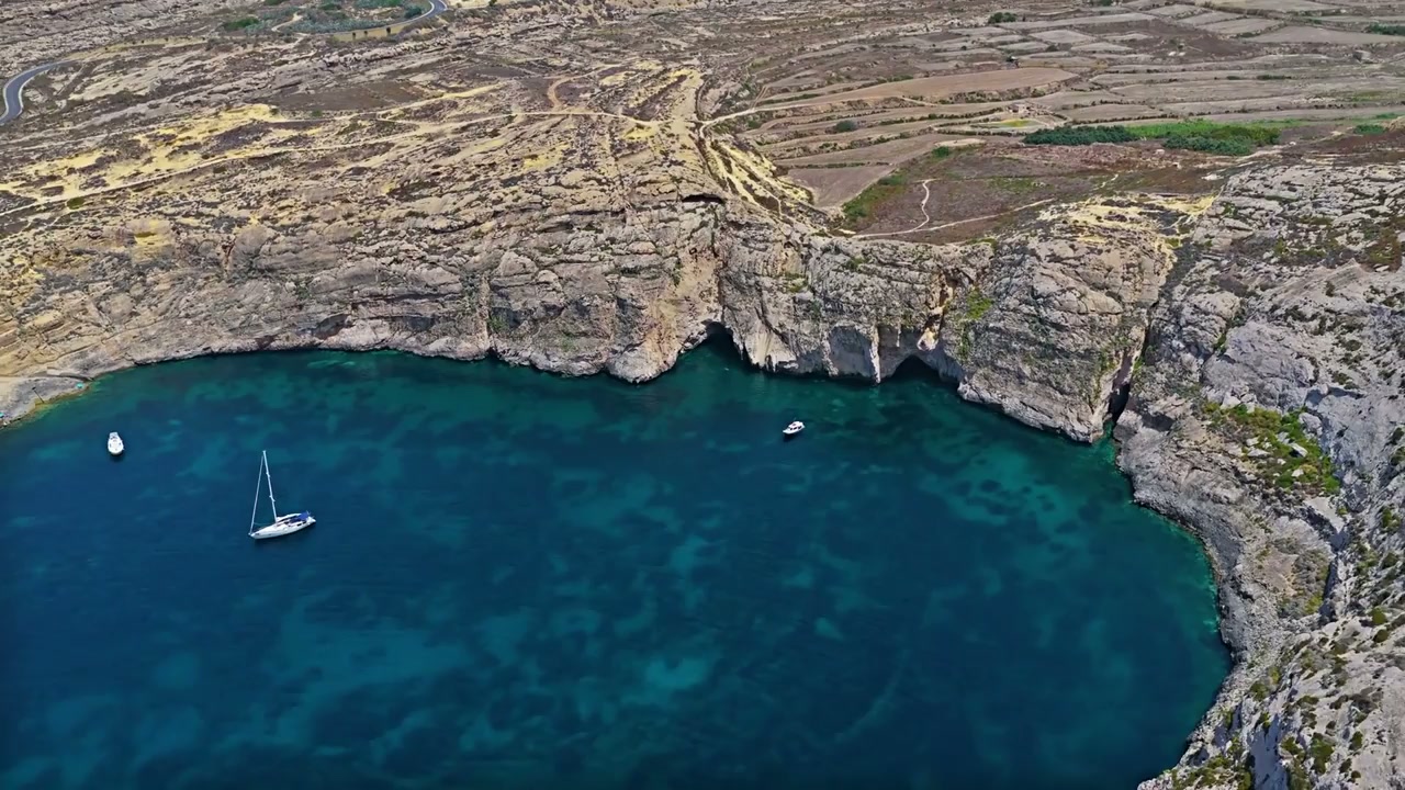 Dwejra, Malta: Drone views of dramatic cliffs and turquoise waters