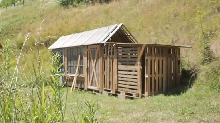 Man Turns Old Wood Pallets Into A Mini Cabin With An Impressive DIY