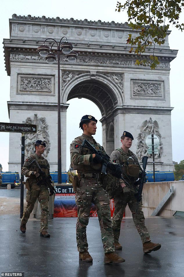 French police seize weapons and gas masks and make arrests as day of ...