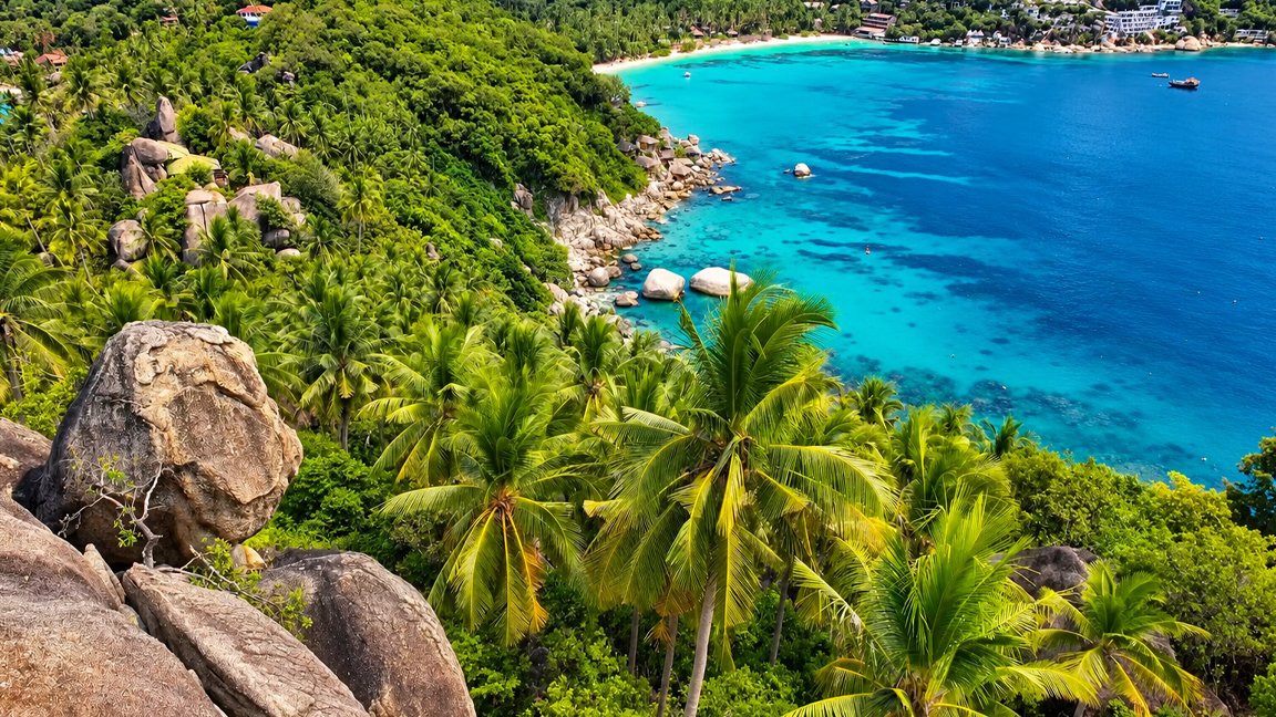 Tropical paradise with crystal clear turquoise waters and lush green ...