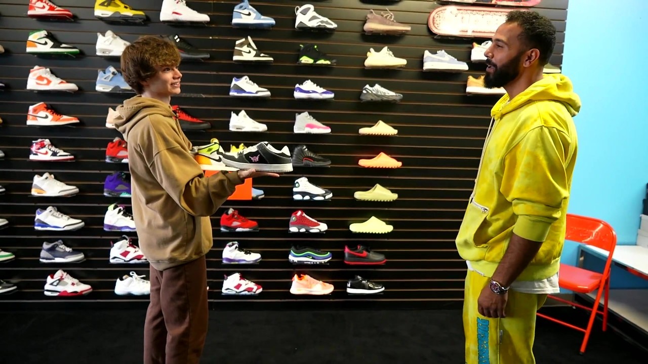 Connor trades sneakers toward an iPhone 13