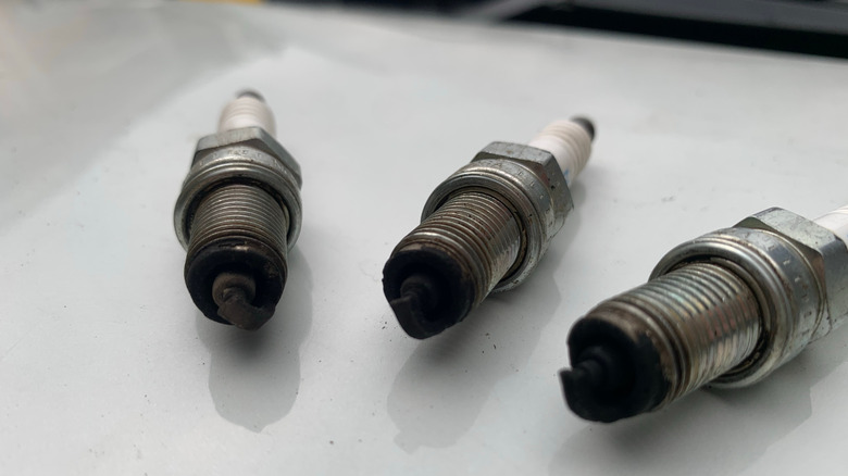 What could it mean if a spark plug is black?