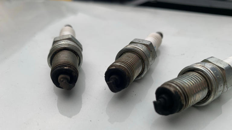 What could it mean if a spark plug is black?