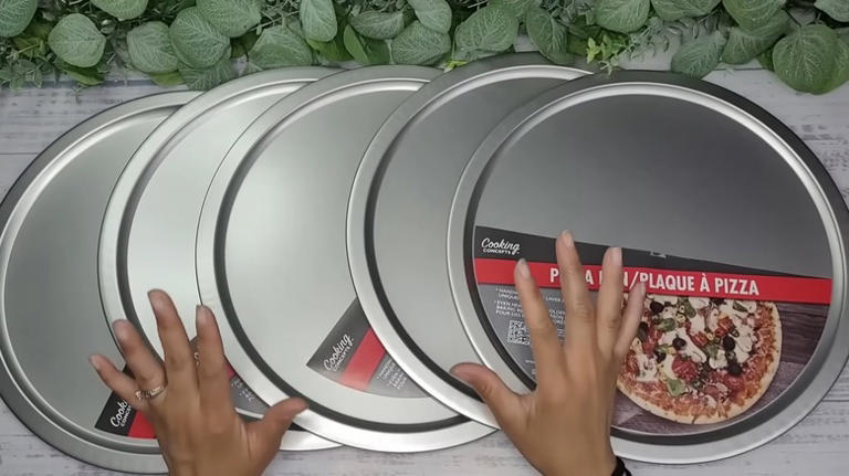 Woman uses a pizza pan to create countertop storage with a unique ...
