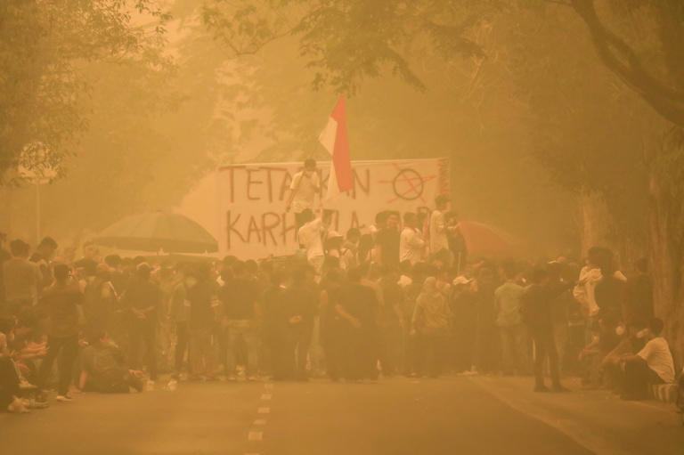 'How is it possible?': Students protest Indonesian haze